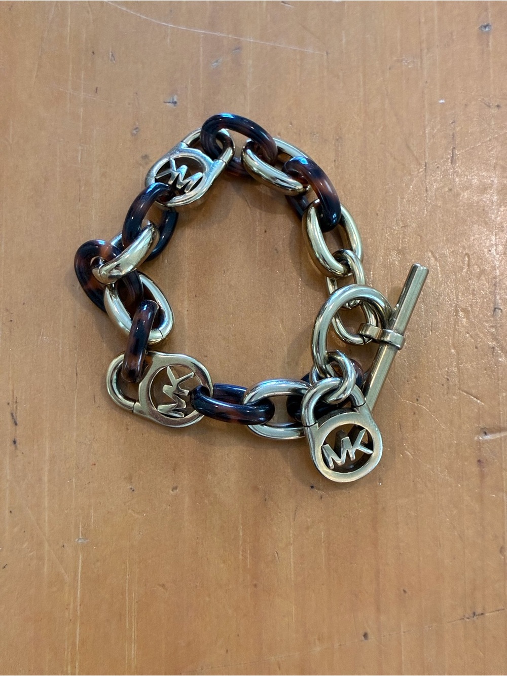 Michael Kors Gold Tone & Tortoiseshell Link Bracelet with MK Charms